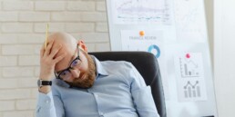 Small business CFO reviewing financial reports with a business owner